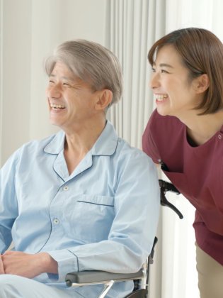 caregiver and senior smiling