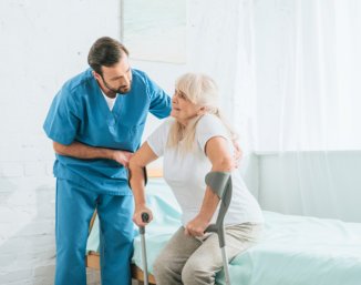 caregiver assisting senior