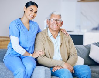 senior and caregiver smiling