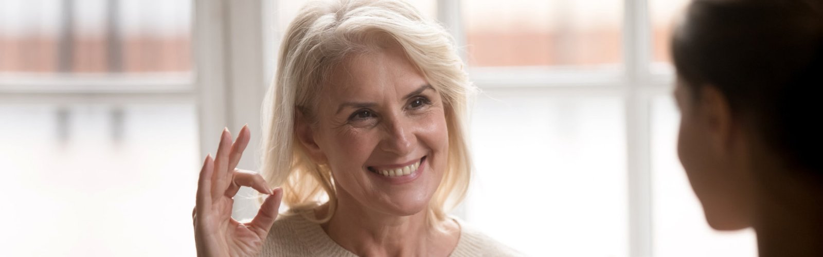 senior doing OK sign hand gesture